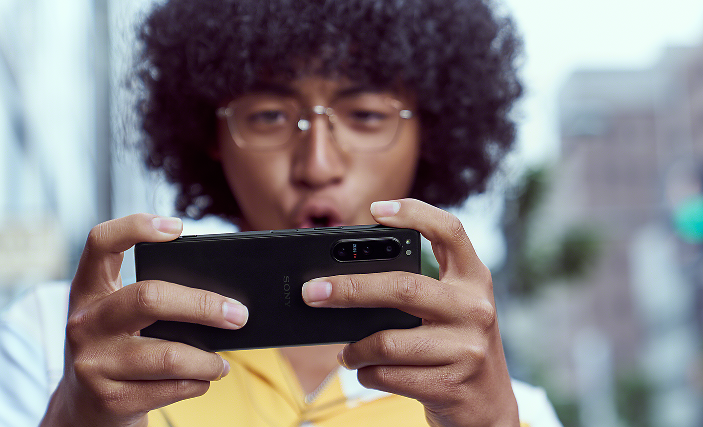 A man gaming on the Xperia 5 IV