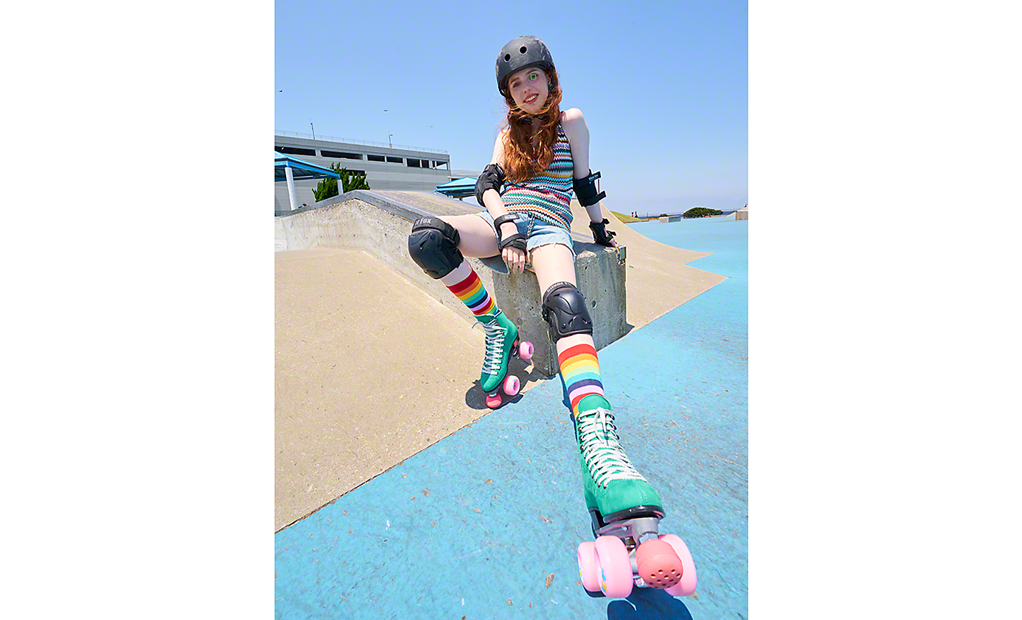 A roller skater at a skate park, a green square over her eye denoting Real-time Eye AF