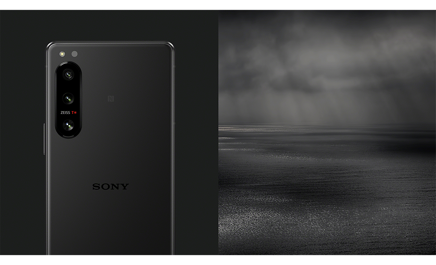 An Xperia 5 IV in black, next to an image of a dark, moody seascape