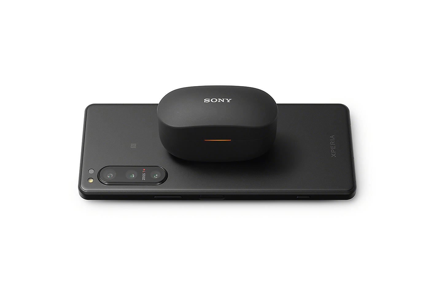 Xperia 5 IV lying flat with a wireless earbud carry case placed on top