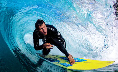 Image of a surfer riding a wave