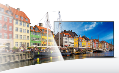 BRAVIA TV with screenshot of boats in a harbor and multicolored houses behind with continuation of the scene extending out of the TV to the left