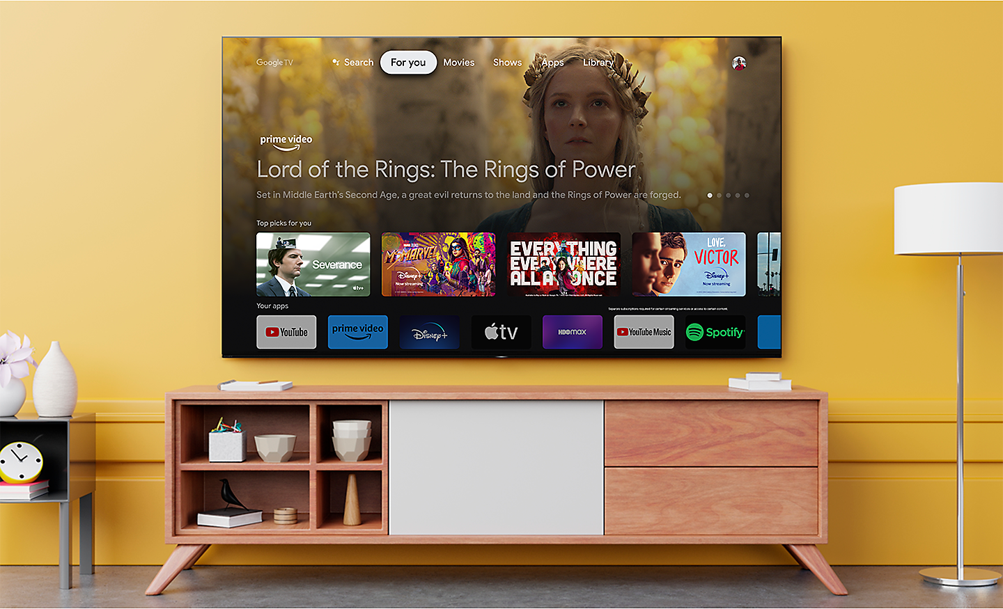 Living room with a wall-mounted BRAVIA XR TV displaying a range of entertainment apps