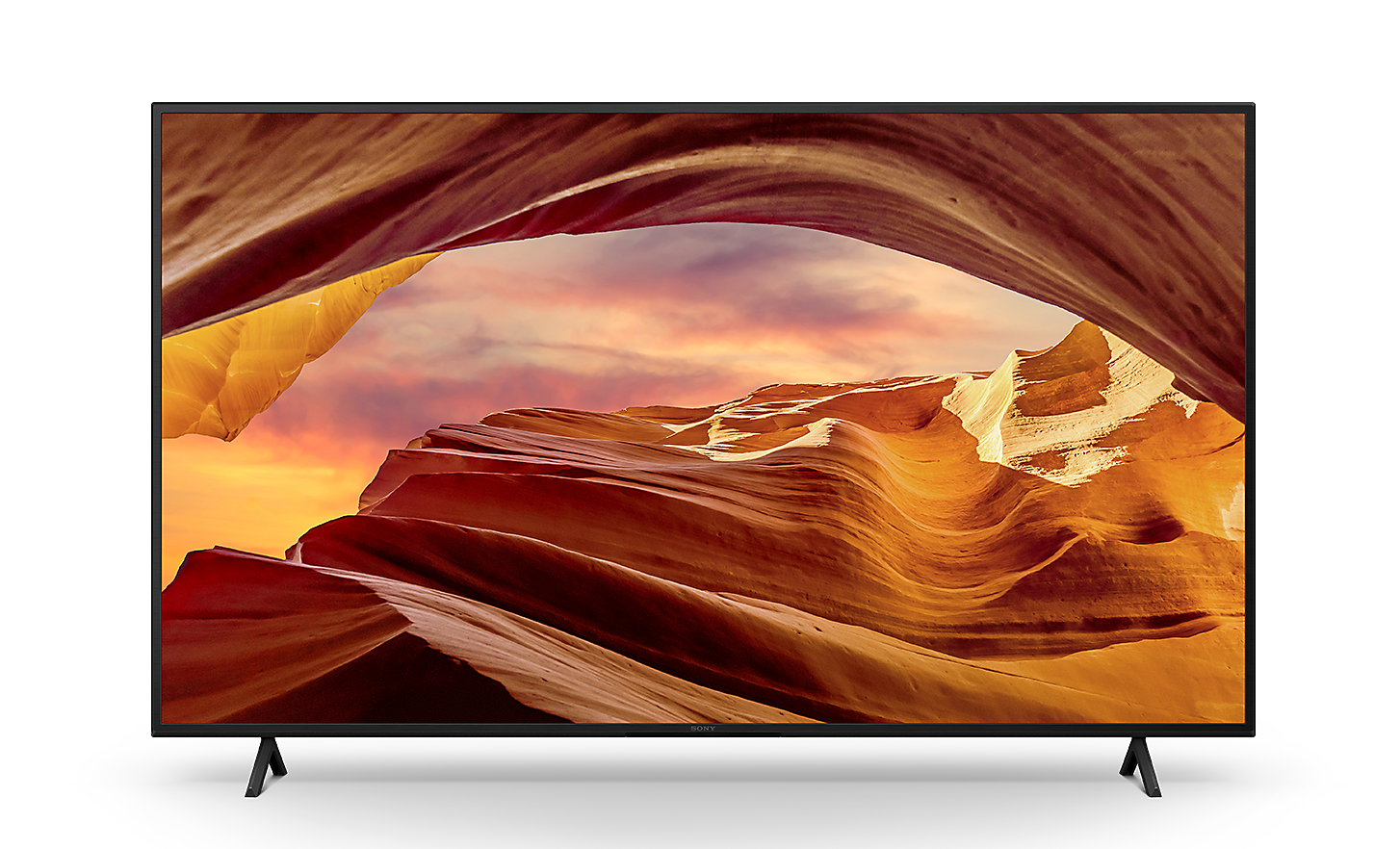 Sprednji pogled na televizor BRAVIA serije X75WL na stojalu, na zaslonu katerega je prikazana spektakularna skalnata pokrajina