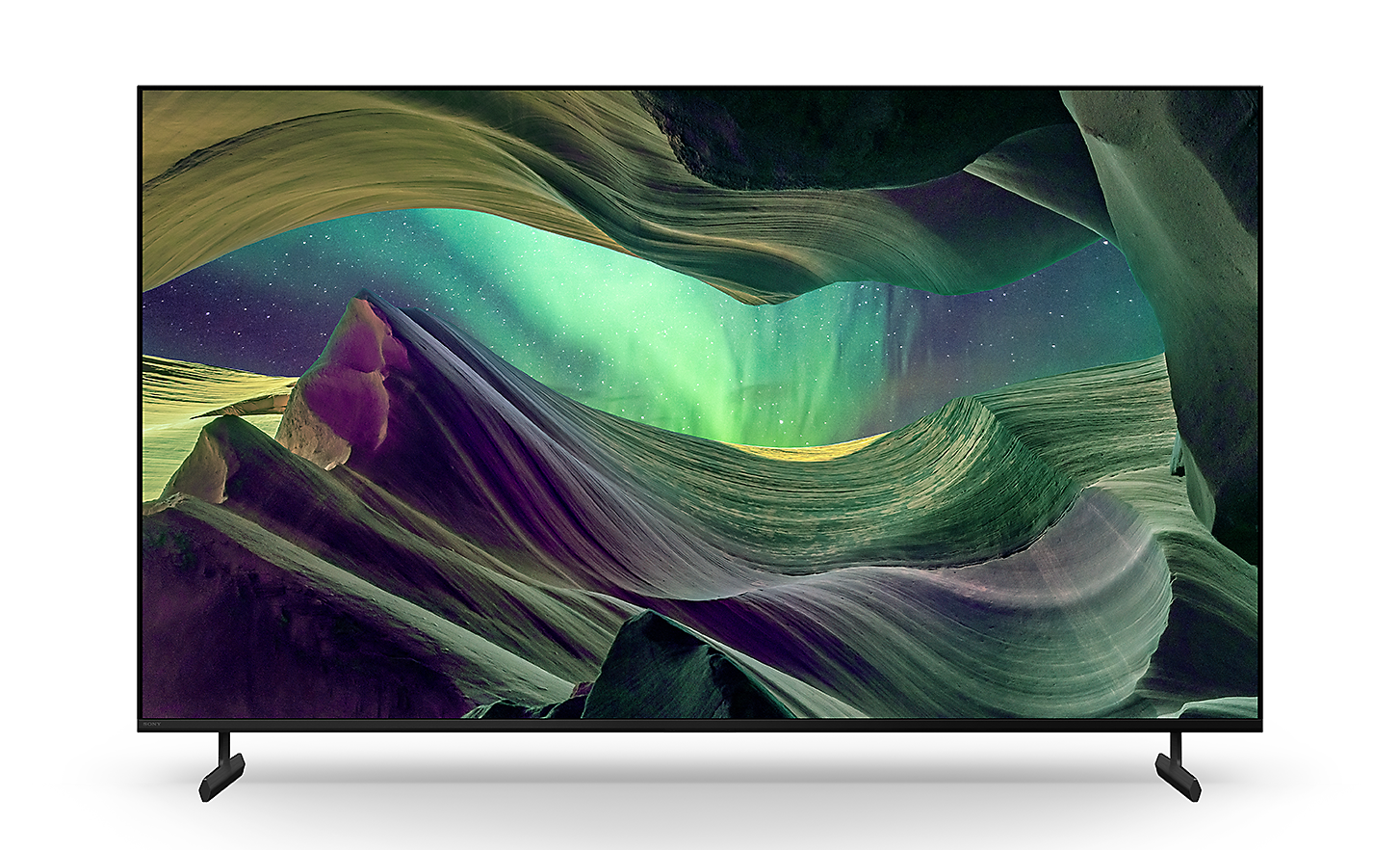 BRAVIA X85L TV on stand with screenshot of rock formations