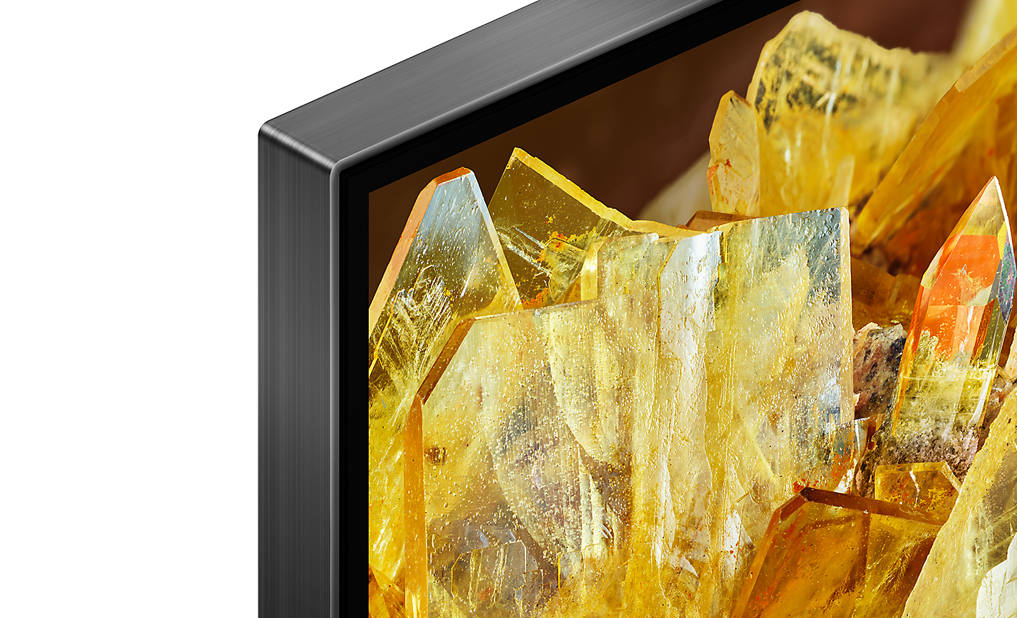Hjørne av en TV som viser gullkrystaller på skjermen