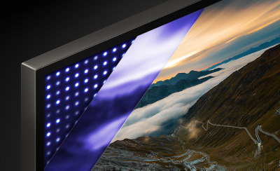 Coin d’un téléviseur affichant des taches blanches et des montagnes