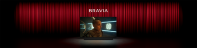 Image of a cinema with red curtains and Sony TV centre stage with screenshot of a person in a sci-fi movie, the word BRAVIA above and Sony soundbar below