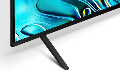 Bottom left corner of TV with slim wedged stand and screenshot of blue water droplets