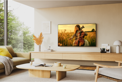 TV in a modern living room, seamlessly blending into the decor with vibrant abstract art displayed on the screen.