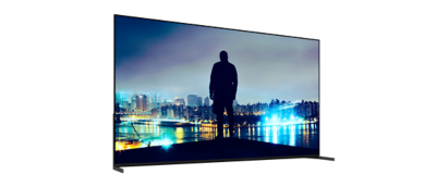 Angled right front view of BRAVIA 8 II with two-way stand, displaying night skyline.