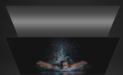 Imagen de una persona nadando con iluminación reducida de un Edge LED convencional.