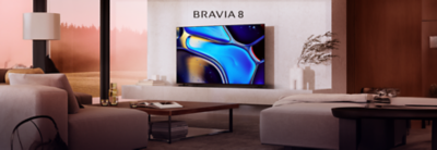 Televisor BRAVIA 8 que muestra imágenes abstractas vibrantes en una sala de estar moderna.