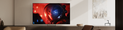 BRAVIA 9 II on its Mirage Stand displaying a vivid scene of an astronaut in a modern living room