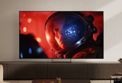 BRAVIA 9 II on its Mirage Stand displaying a vivid scene of an astronaut in a modern living room