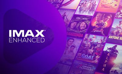 IMAX Enhanced logo on a purple background featuring a collage of film posters including Anaconda, Karate Kid Legends, Alpha, Gran Turismo, and GOAT.