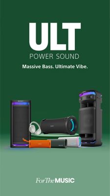 Image of artist crouching besides the large party speaker