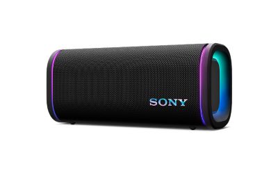 Horizontal black Sony ULT FIELD portable speaker with glowing LED end rings and colorful Sony logo on plain background.