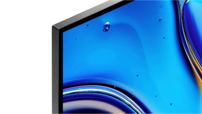 Фрагмент лівого верхнього кута екрана телевізора зі скріншотом жовтих, синіх і чорних крапель води