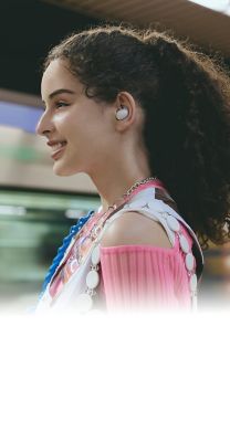 Image of a woman standing on a subway platform