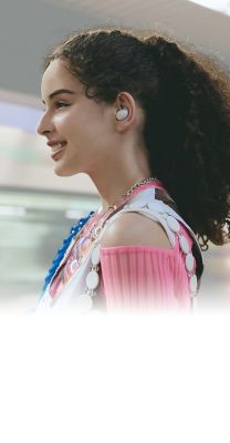 Image of a woman standing on a subway platform