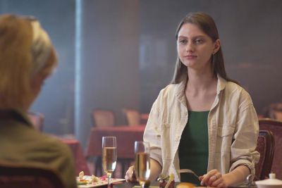 Woman sitting at dining ntable