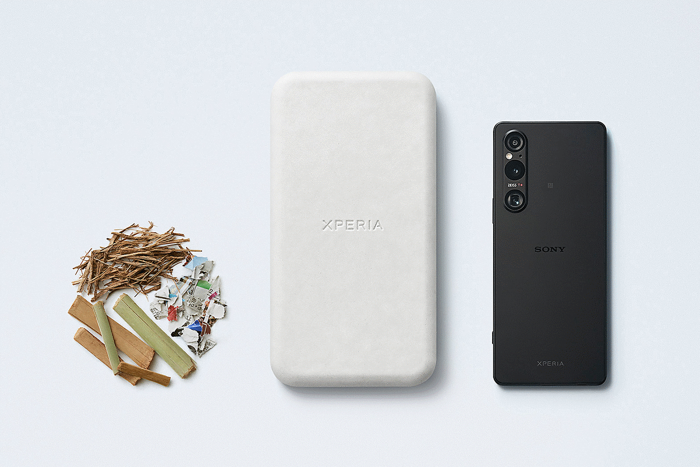Image of Xperia products alongside the three main components of Sony's Original Blended Material: bamboo, sugar cane and recycled paper.