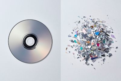 Image of an disc on the left with it broken down into smaller crushed waste particles on the right.