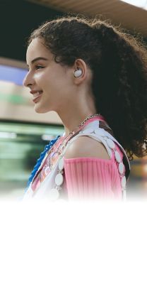 Image of a woman standing on a subway platform