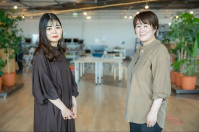 Portrait of two employees