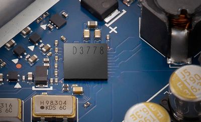 Extreme close‑up of audio processing IC and peripheral circuit parts