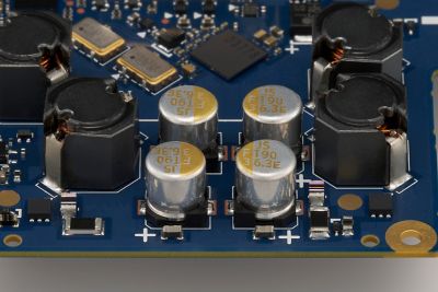Reverse‑angle shot of analogue circuit components such as FT CAP3 (High polymer capacitor)