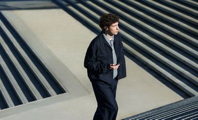 A person walking up a flight of outdoor stairs