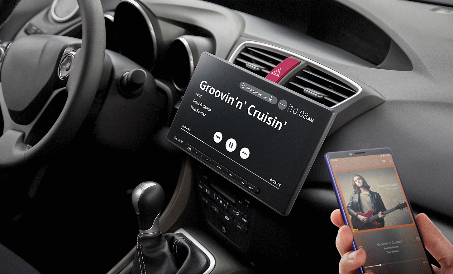 Image of the XAV-AX8500 in position in a car connected to a phone via Bluetooth®  and playing music