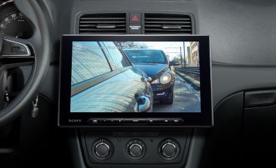Image of the XAV-AX8500 in position with the left rear mirror camera displayed on-screen