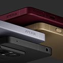 Czerwony, złoty, srebrny i czarny telefon ułożone jeden na drugim