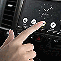 Image of a finger selecting an option on the XAV-9000ES home screen.