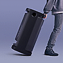 Image of a person rolling the SRS-XV900 wireless speaker with its convenient carry handle