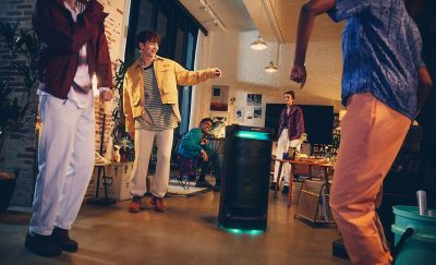  Image of people enjoying the features of the SRS-XV900 speaker
