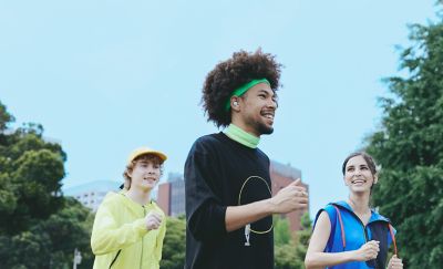 Three runners, one of whom is wearing a pair of LinkBuds Open earbuds.