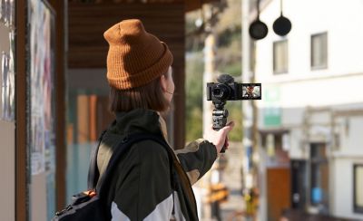 A person wearing a hat taking a selfie