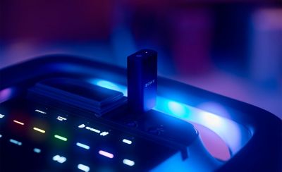 The top of the TOWER 9 speaker is visible with the plug and play receiver inserted into the top panel