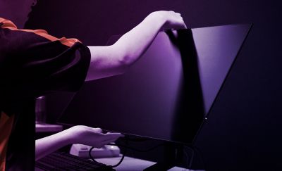 Person adjusting an INZONE M10S II screen on a stand