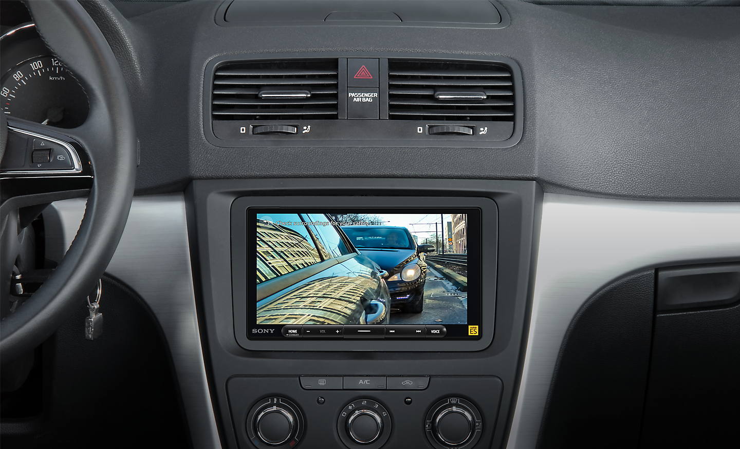 Internal view of car dashboard showing the parking assist camera in use. 