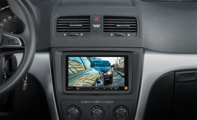 Internal view of car dashboard showing the parking assist camera in use. 