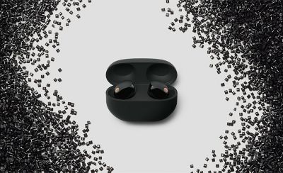 Image of WF-1000MX5 headphones in the middle surrounded by pieces of plastic materials