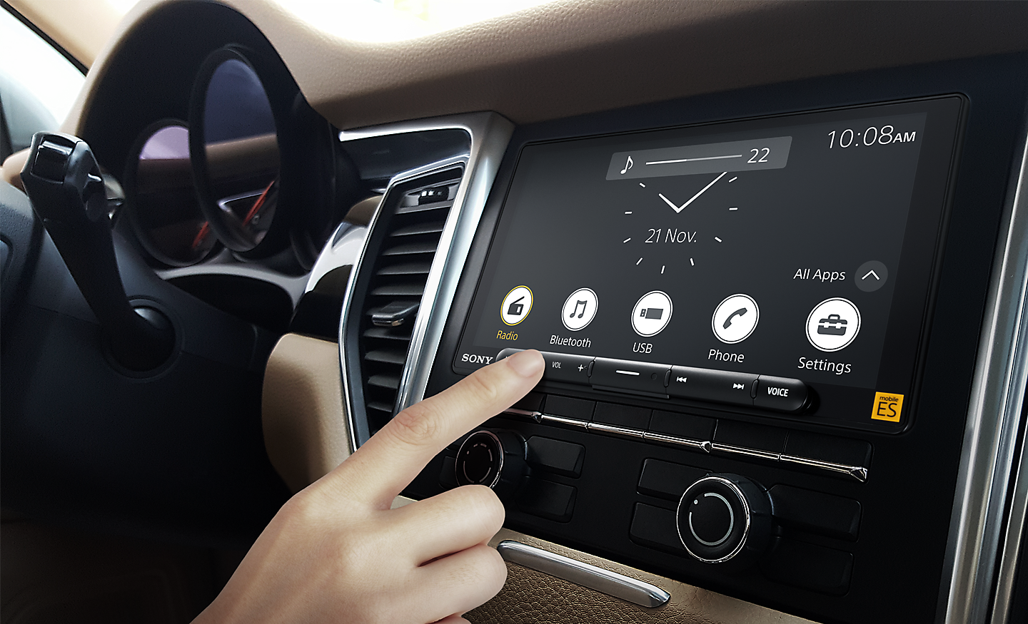 Interior of a car showing a user interacting with the XAV-900ES media receiver.
