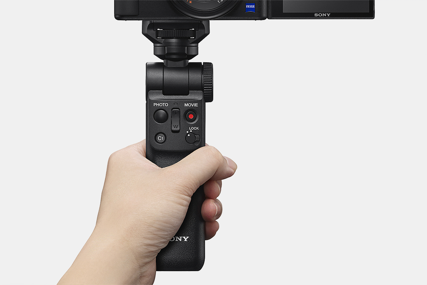 Holding the Bluetooth grip attached to the ZV-1.