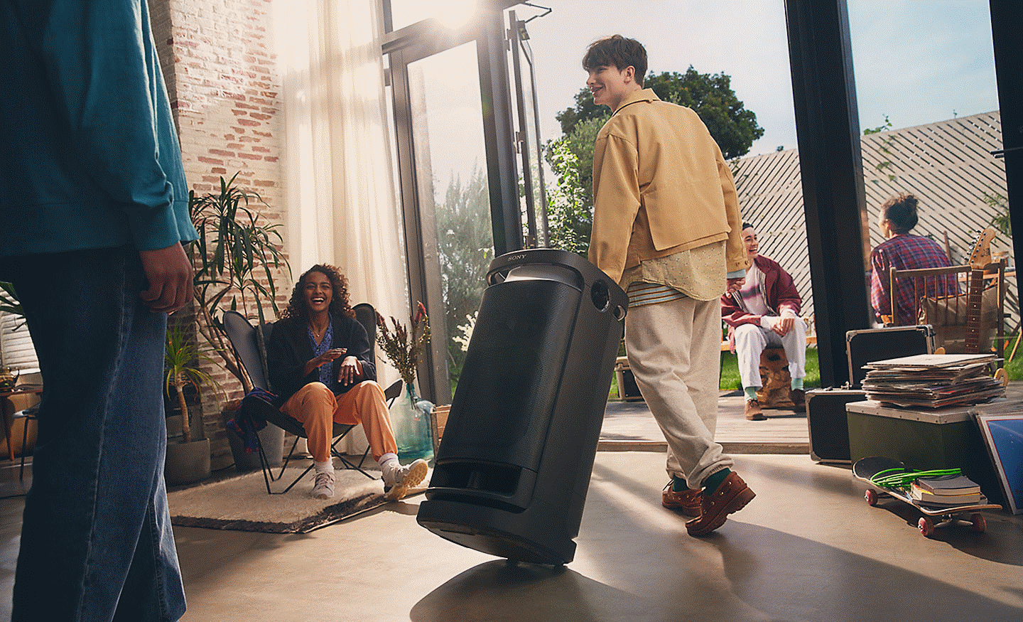 Image of a person rolling the SRS-XV900 speaker with its convenient carry handle