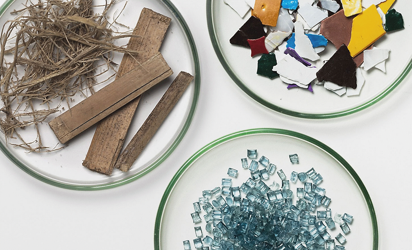 A range of recycled materials dispalyed on glass plates